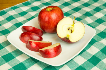 Empire apple slices on white plate