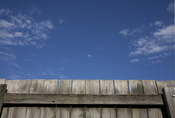 Wooden fence under blue sky