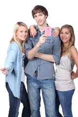 Fototapeta premium young man showing his driving license