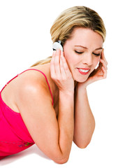 Close-up of a woman listening music
