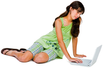 Obraz na płótnie Canvas Teenage girl using a laptop