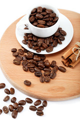 Cup with coffee beans isolated on white background.