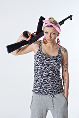 Young woman with automatic rifle
