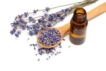 Dried lavender with a bottle of essential oil