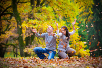 Fototapeta premium Portrait of couple enjoying golden autumn fall season