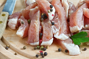 Fresh raw meat on wooden background with pepper