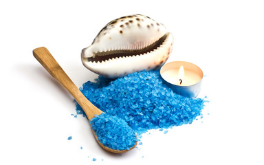 Sea salt with seashell and candle  isolated on white