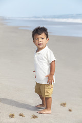 Hispanic Child Boy Happy Playing at a Sunny Beach