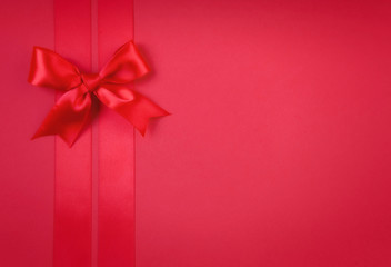 A red ribbon bows