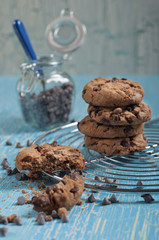 Closeup of broken biscuit and jar with chok drops