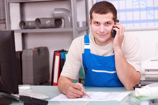 Plumbers Merchant On The Telephone