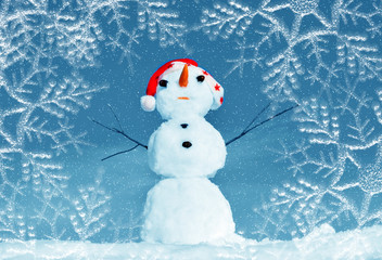 Snow man in santa cap on nature