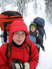 Hiker in winter mountains snowshoeing.