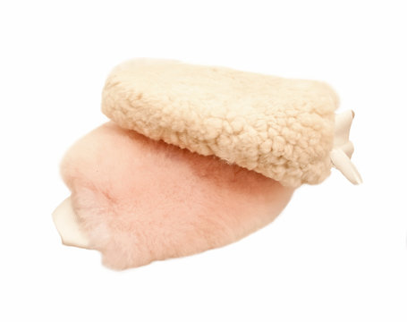 sheepskin mittens for finishing grooming horse isolated