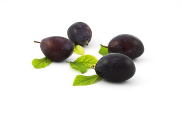 Ripe plums and leaves
