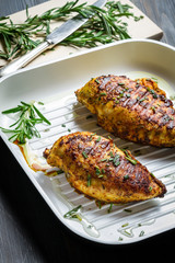 Grilled chicken breast in a pan