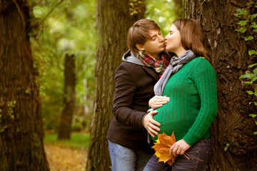 Pregnant couple in  the park