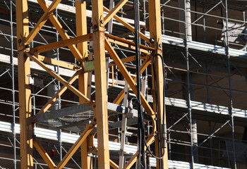 Fototapeta premium cranes and scaffolding on a construction site
