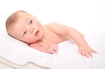 baby laying on pillow