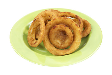 Onion rings on green plate