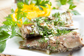fried river fish with garlic and herbs