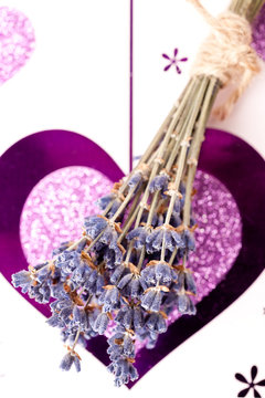 Fototapeta Small bouquet of lavender on a background with a heart
