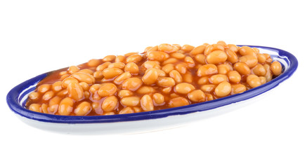 Marinated haricot beans in tomato sauce with shallots on a plate