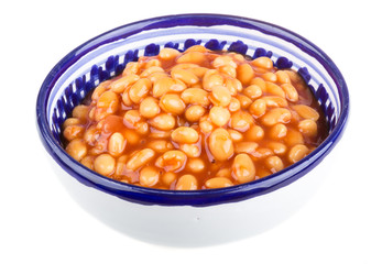 Marinated haricot beans in tomato sauce with shallots on a plate