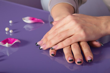 Obraz na płótnie Canvas Woman hands with french manicure with crystals