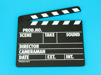 Movie production clapper board on color background