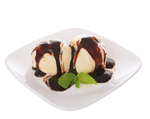 delicious ice cream with chocolate and mint leaves on plate