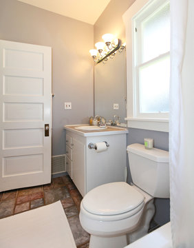 GREY and white small bathroom.