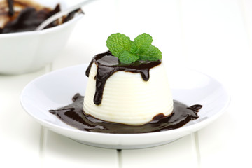 Panna cotta with chocolate sace and fresh mint