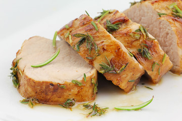 Sliced pork tenderloin or sirloin in herbs and honey glaze