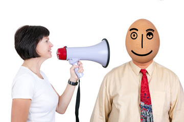Woman with megaphone speaking to a man with egg head