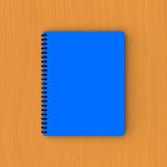 Blue paper notebook on plywood