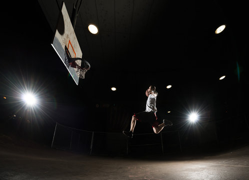 Basketball player at night