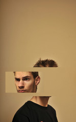 Divided head of a young man