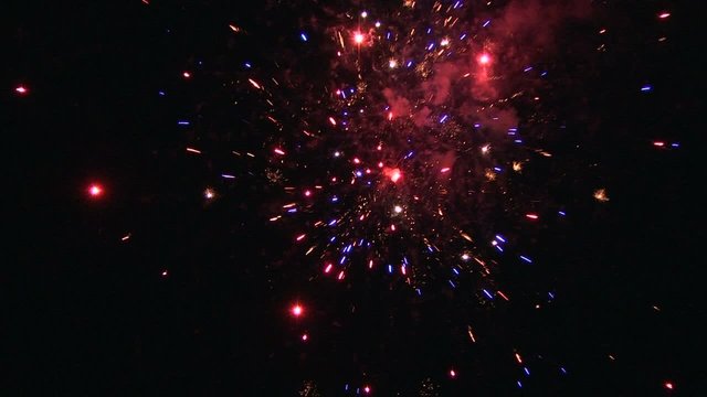 fireworks against a black sky with sound