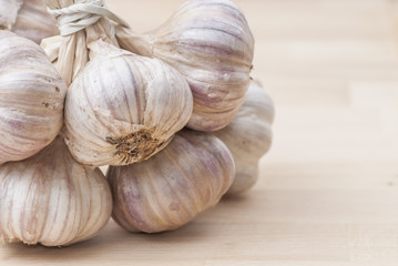 Bunch of Garlic on Wooden Surface.