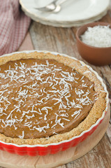 Pie with pumpkin and chocolate in ceramic form top view