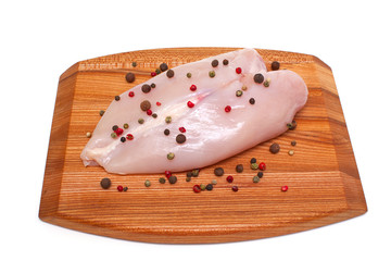 chicken breast on cutting board