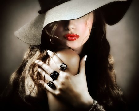 Sexy young pretty woman with red lips, vintage jewelry kiss