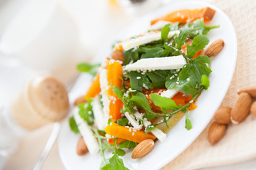 Salad with goat cheese and yellow sweet pumpkin