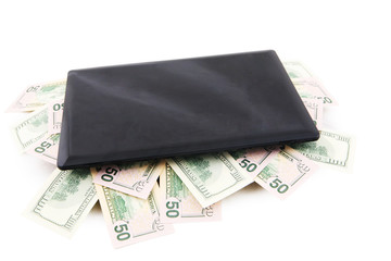 Computer laptop and US dollars