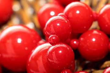 Red Necklace over brown basket background