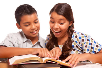 Hispanic Brother and Sister Having Fun Studying