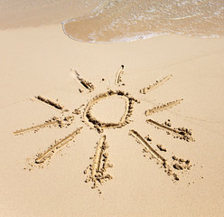 The sun - a picture on sand