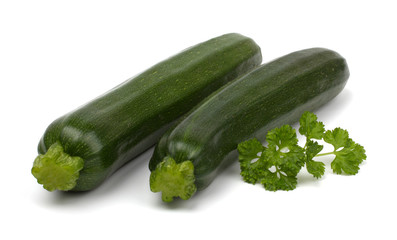 Two fresh vegetable zucchini isolated on white background