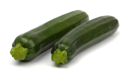 Two fresh vegetable zucchini isolated on white background